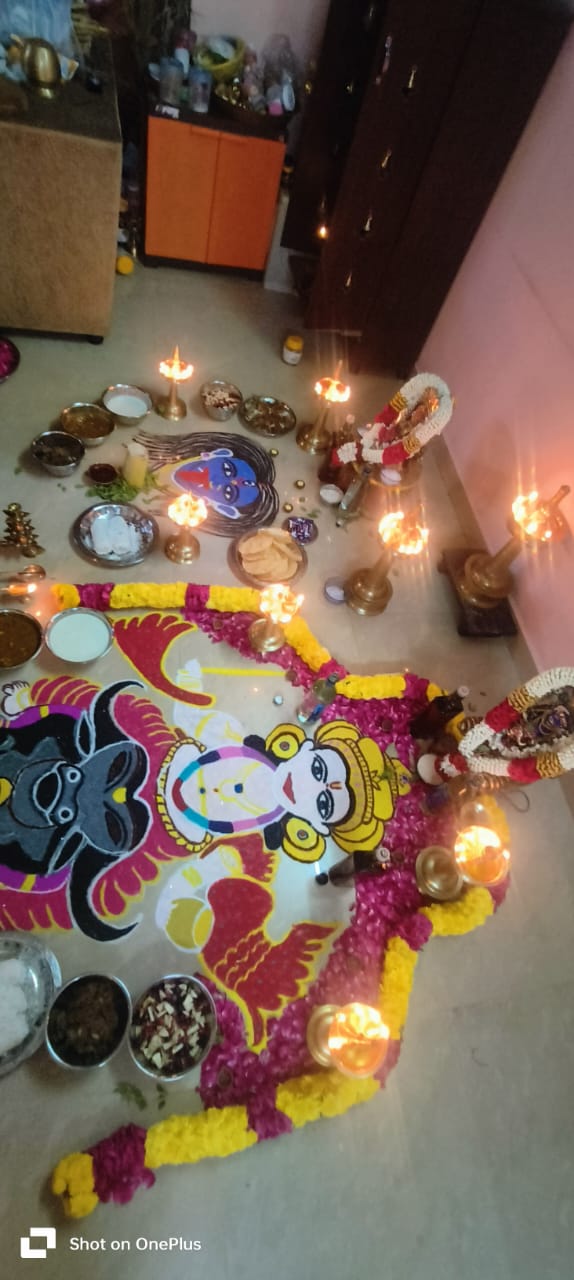 Floor ritual with lamps and offerings in Chennai