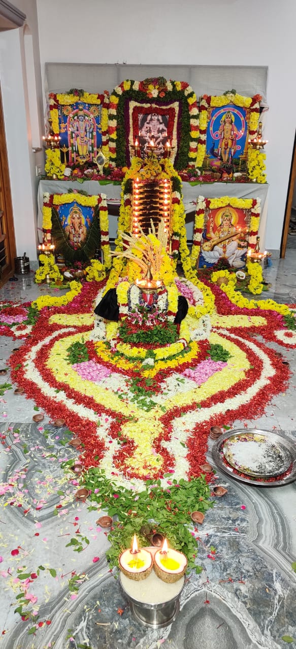 Decorated shrine with multiple deity frames in Chennai