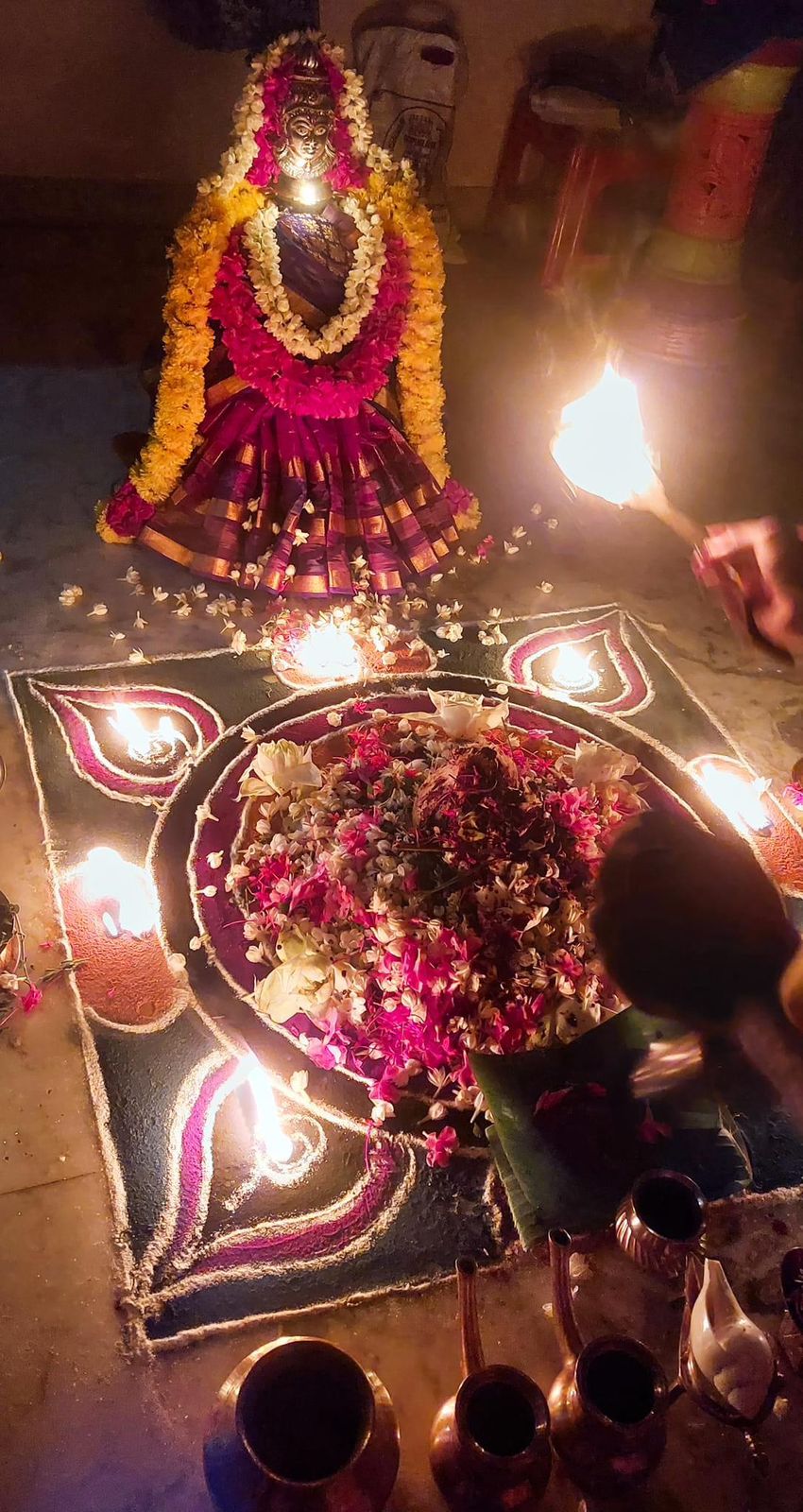 Pooja arrangement with lamps and flowers in Chennai